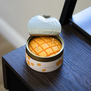 Aromatizēta svece konservu bundžā, mango trauks