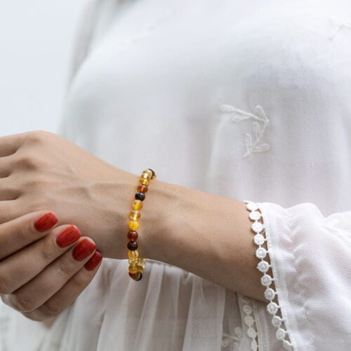 Dzintara aproce ar gaišām bumbiņām, ⌀ 6 cm