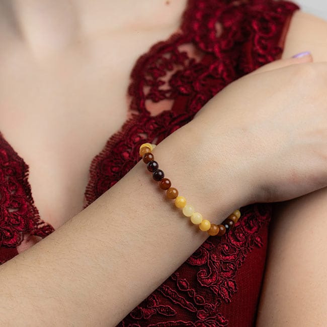 Aproce ar dzintara pērlītēm, daudzkrāsaina, 6 cm