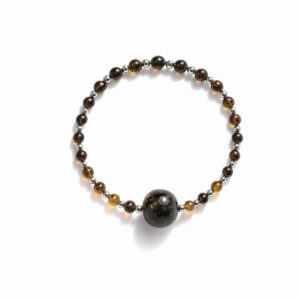 Dzintara aproce ar sudraba krāsas elementiem ⌀ 5.5 cm