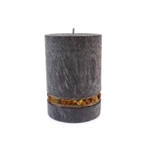 Candle with amber pieces around, dark grey
