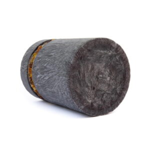 Candle with amber pieces around, dark grey