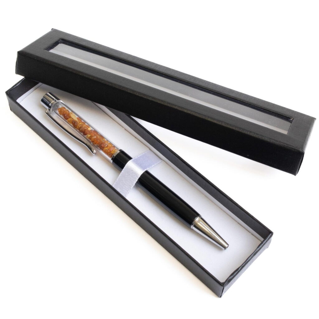 Pen with amber pieces, black and silver color details, in a box