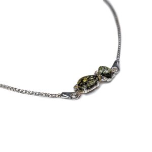 Silver bracelet with greenish amber kitty