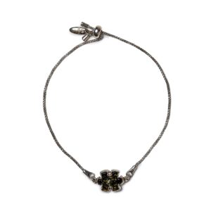 Silver bracelet with greenish amber puzzle piece