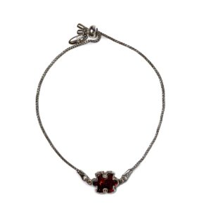 Silver bracelet with orange-red amber puzzle piece