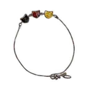Silver bracelet with three amber cats