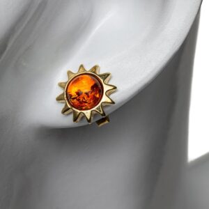 Silver earrings sun-shaped with orange amber, gold plated