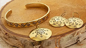 Traditional Latvian jewelry with ethnographic ornaments and signs