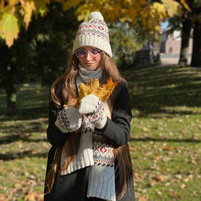 Knitted wool hat with pattern and pom pom, rollup edge, white