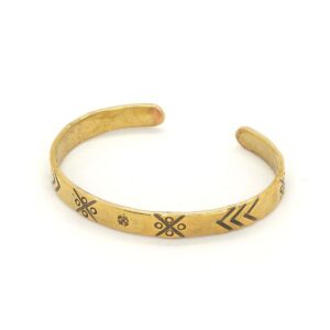 Brass bracelet with ethnographic symbols