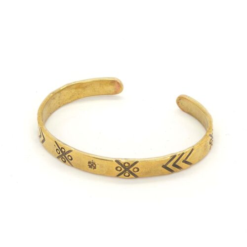 Brass bracelet with ethnographic symbols
