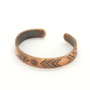 Copper bracelet with ethnographic symbols