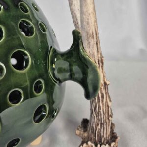 Ceramic candle holder with antler element, greenish-brown