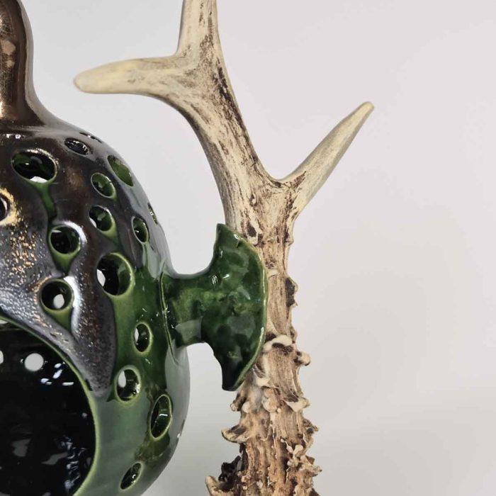 Ceramic candle holder with antler element, greenish-brown