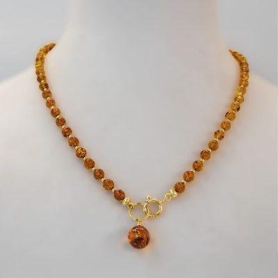 Amber necklace with gold color elements, 45 cm