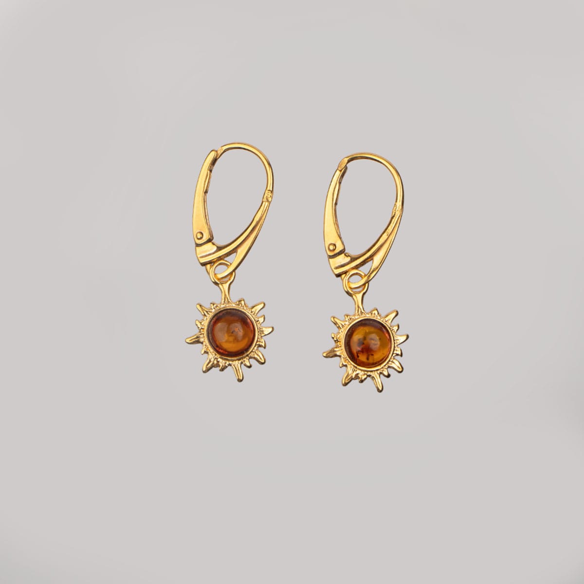 Silver earrings in sun shape with orange amber piece, gold plated (copy)
