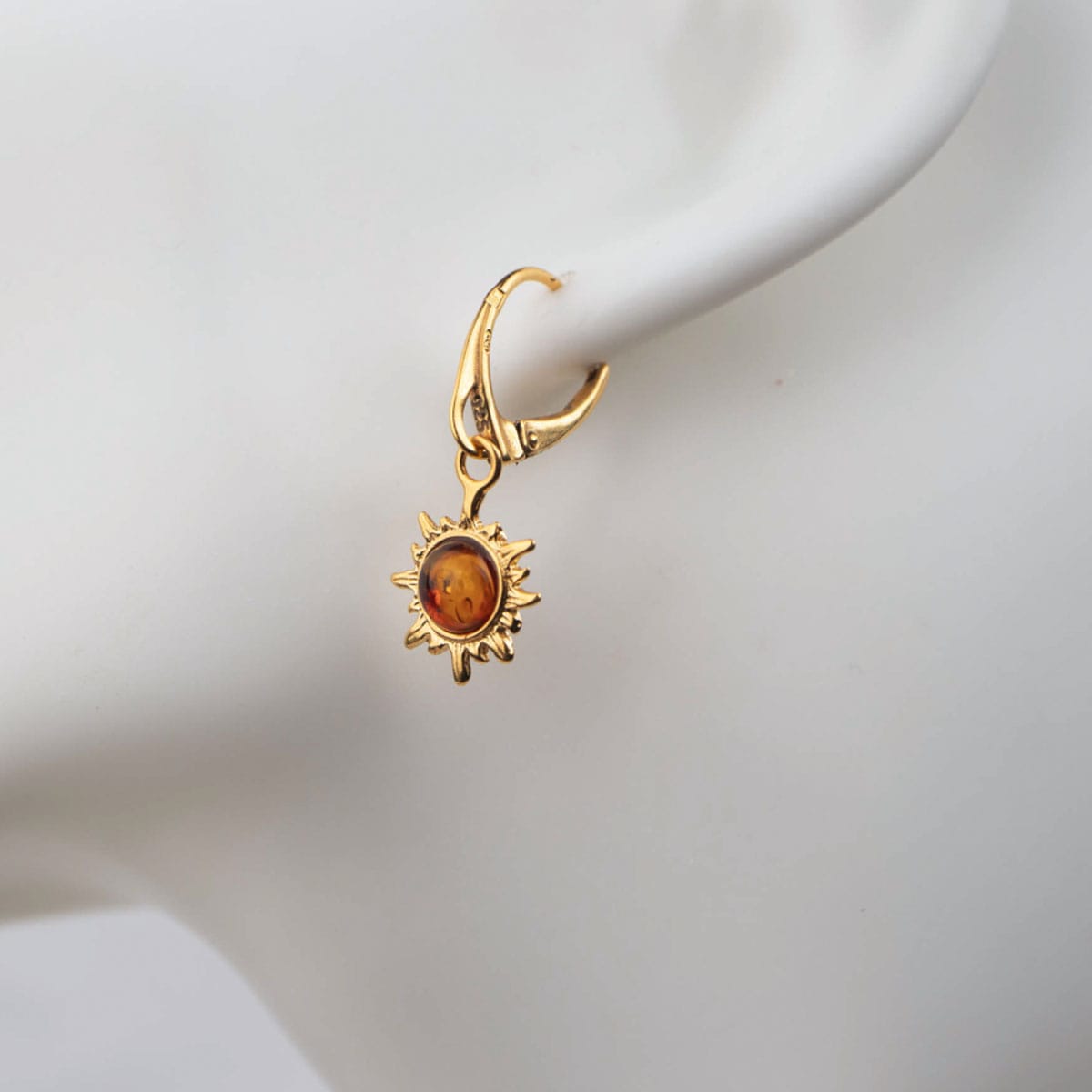 Silver earrings in sun shape with orange amber piece, gold plated (copy)