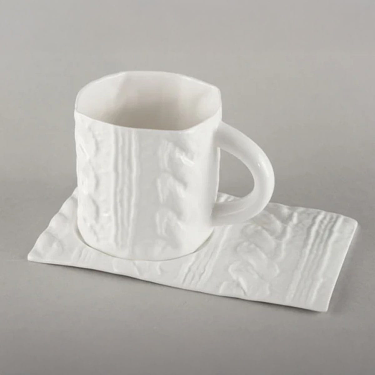 Porcelain mug saucer with knitted texture