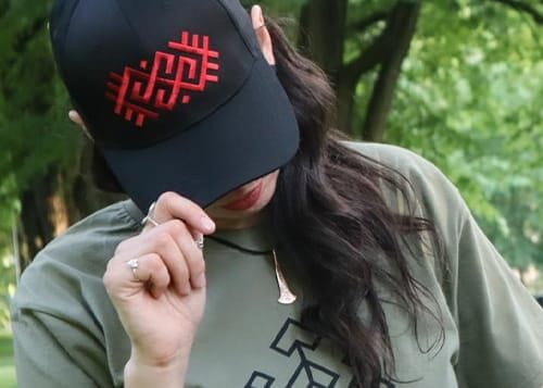 Home section: categories Black cap with a red Latvian symbol.