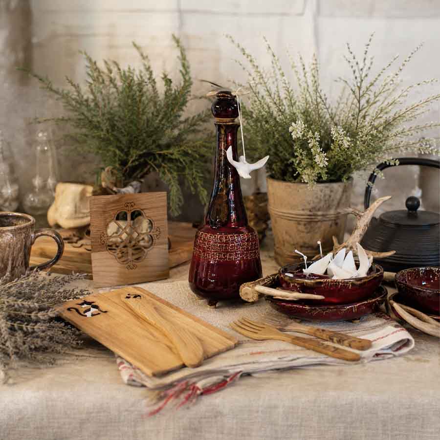 Home section: categories atvian Kitchen & Dining Collection – ceramic carafe 1 liter, wooden coaster small, carved serving board and artisan wooden utensils, Baltic gift ideas.