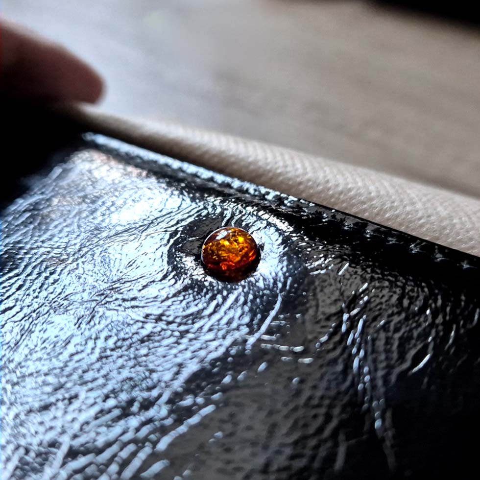 Genuine glossy leather wallet with amber, black