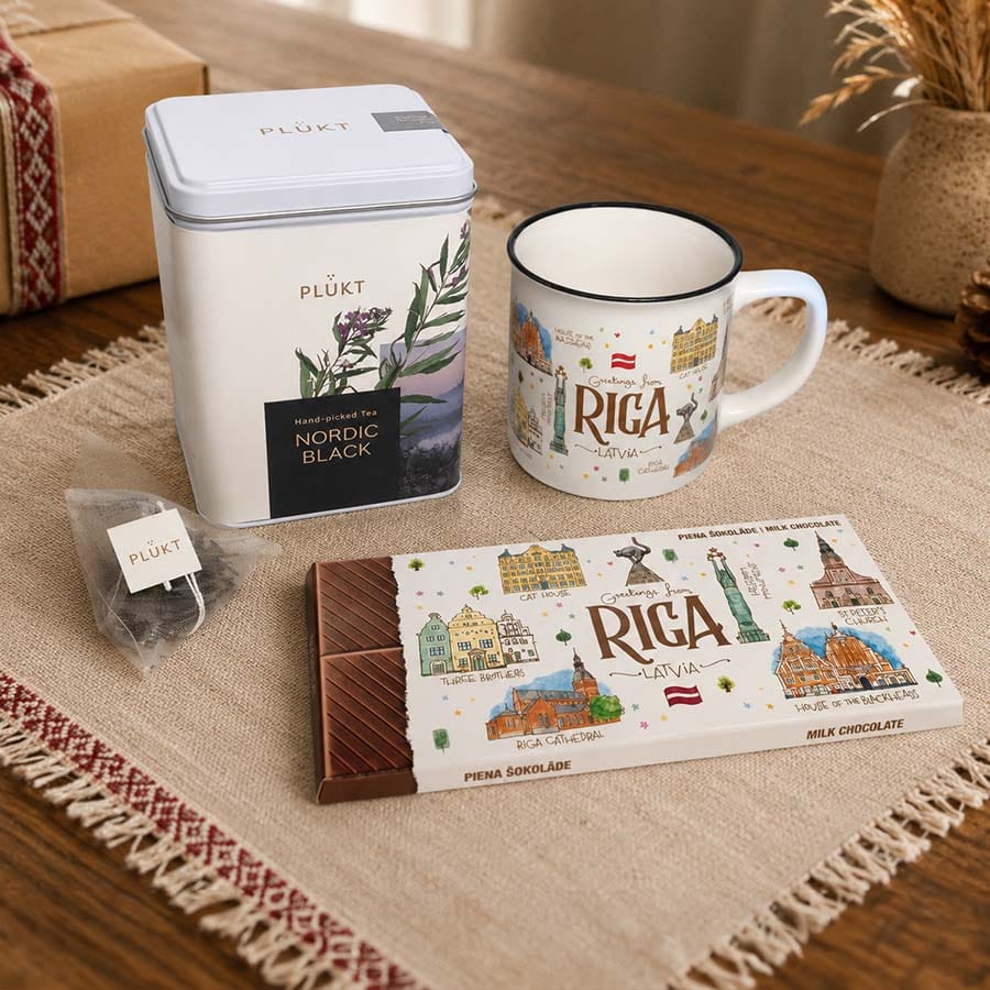 Riga gift set styled on a table with tea, mug and chocolate