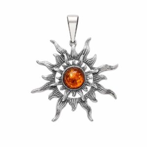Silver pendant in sun shape with orange amber piece